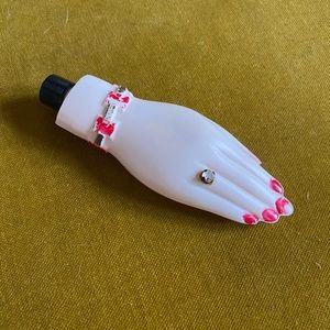 Quirky vintage hand with ring lotion bottle